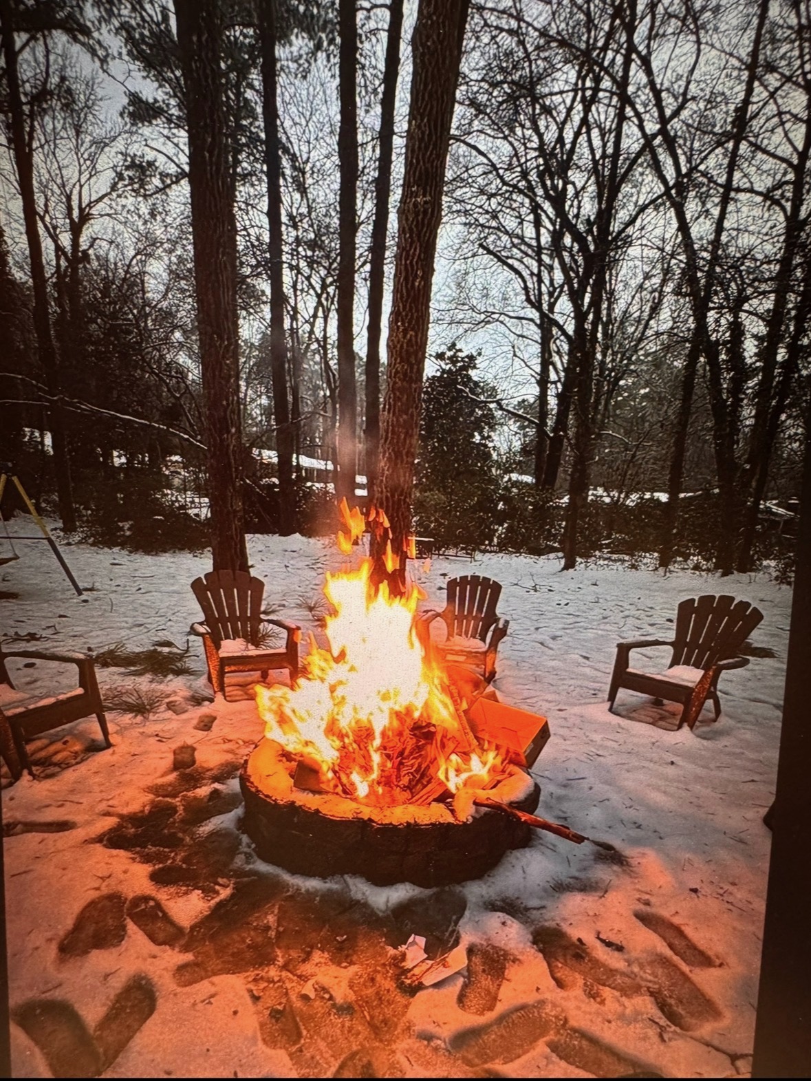 Gathering warm around the firepit on a quiet winter evening, releasing limiting beliefs.